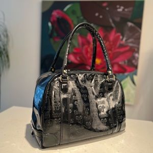 TNA vintage black patent duffel bag